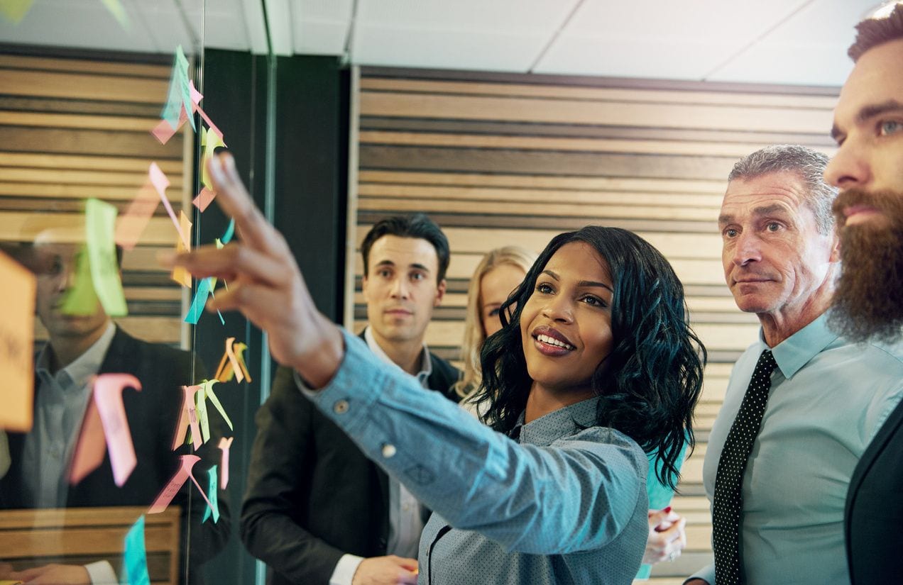 Woman of color leads group of employees