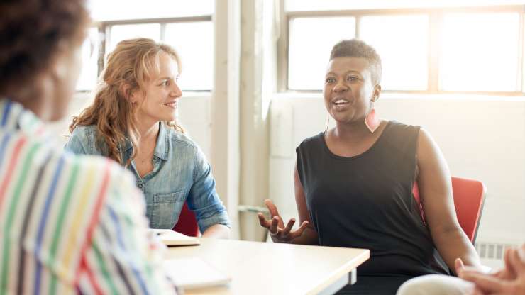 Diverse_women_discussing_meeting